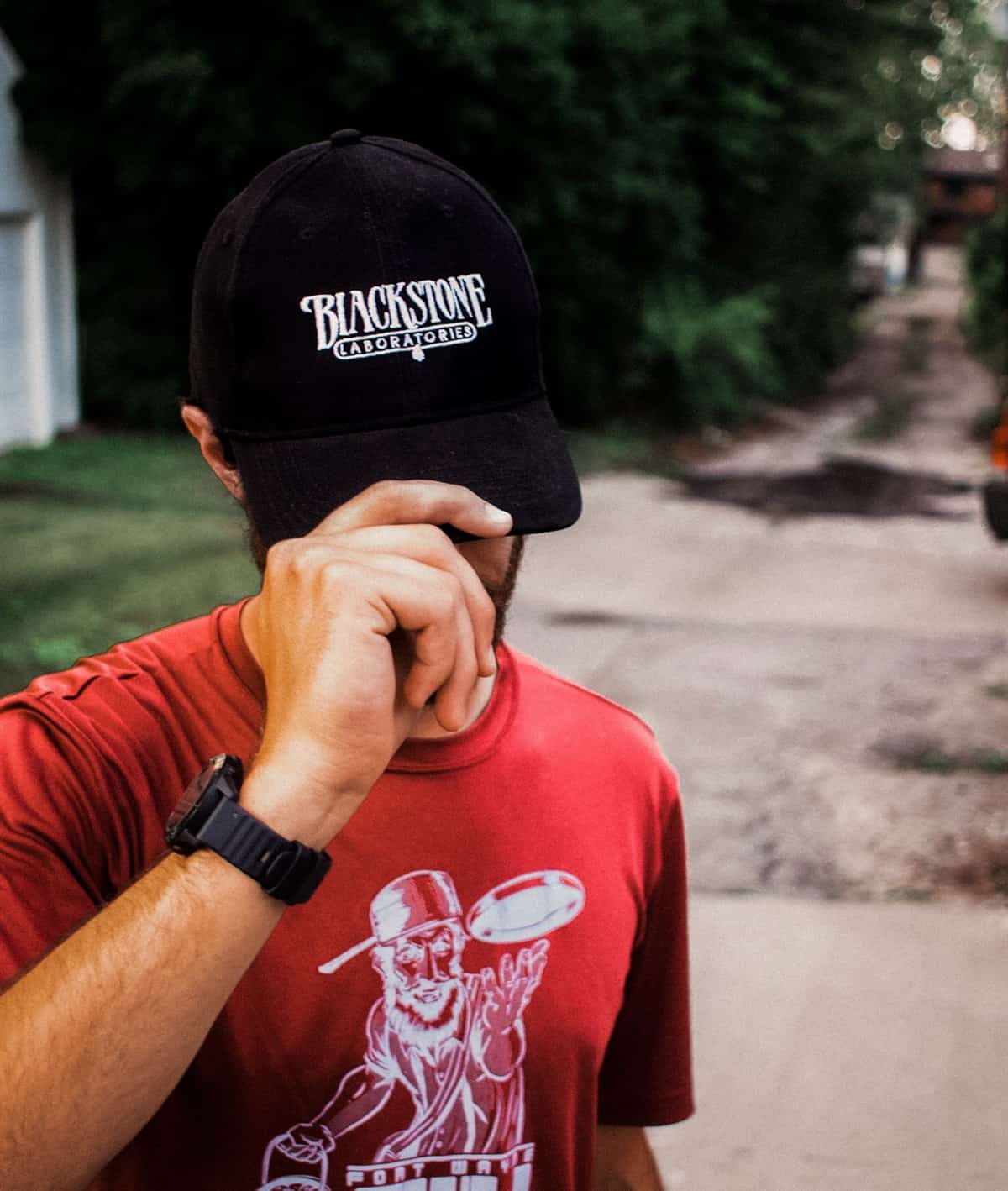 Blackstone Joe wearing a Blackstone Laboratories ballcap with white logo stitched on the front