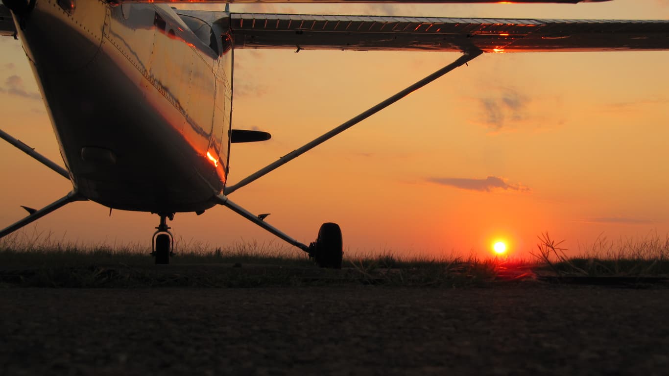 aircraft landing at sunset