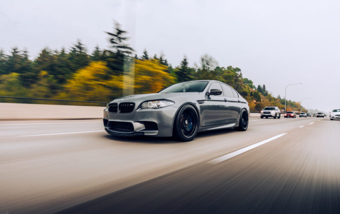 Gray BMW moving on the highway