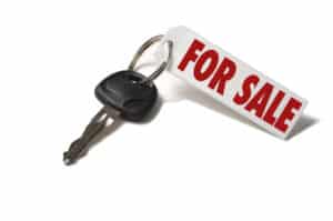 car key with red and white for sale tag