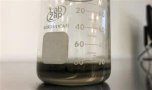 Oil from the lower unit, showing a clear separation between the oil and a layer of water contamination