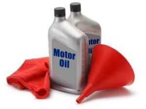 generic motor oil bottles with funnel and rag