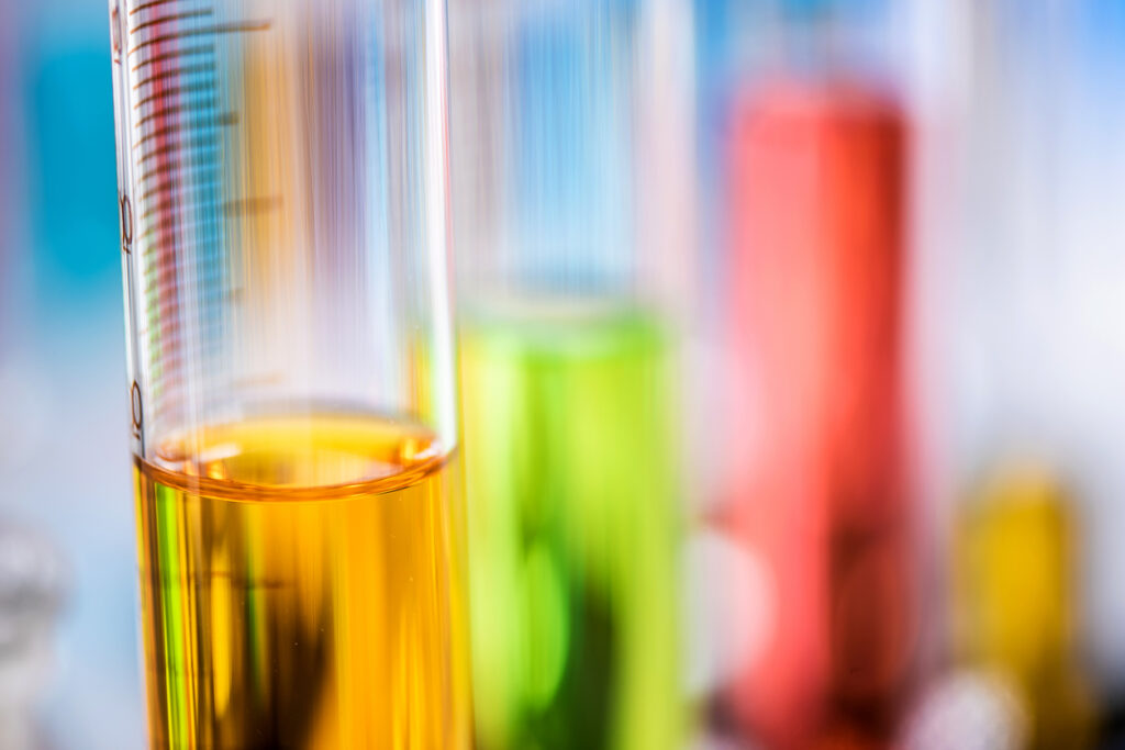 Oil, coolant, and fuel samples in test tubes for analysis